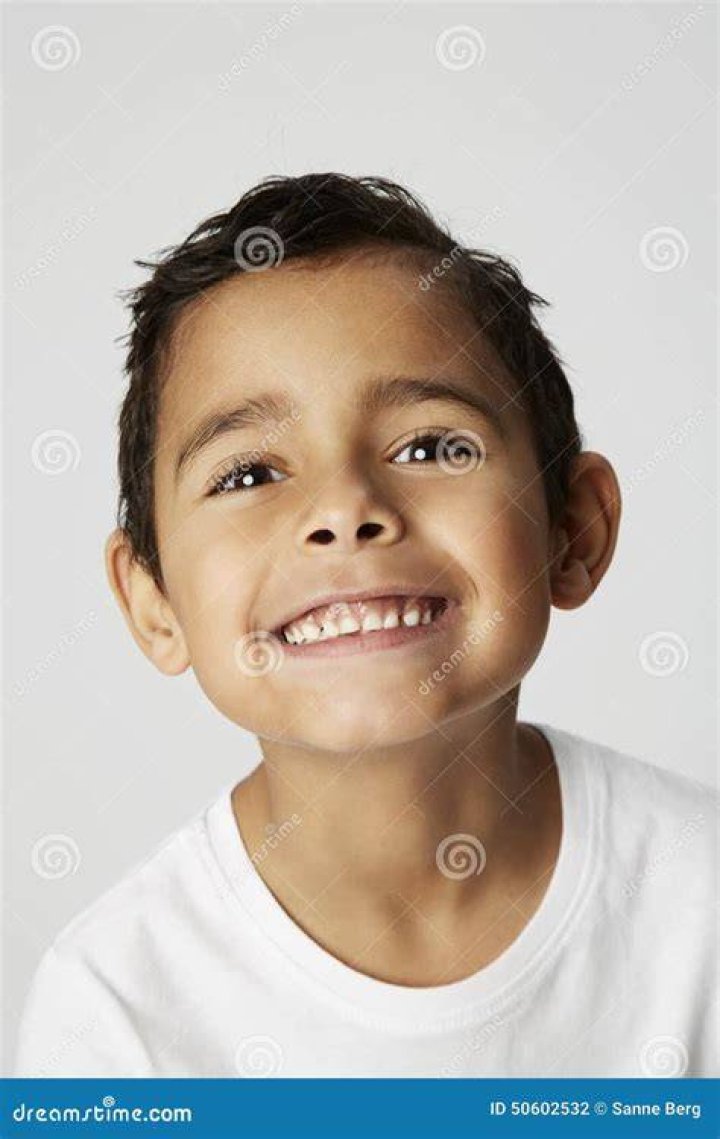 cheeky boy with cheeky smile Stock Photo Alamy